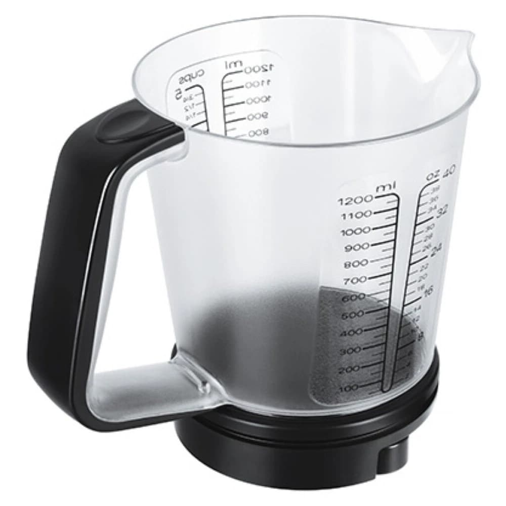 The kitchen scale: a clear measuring jug with a black handle standing on its round black base
