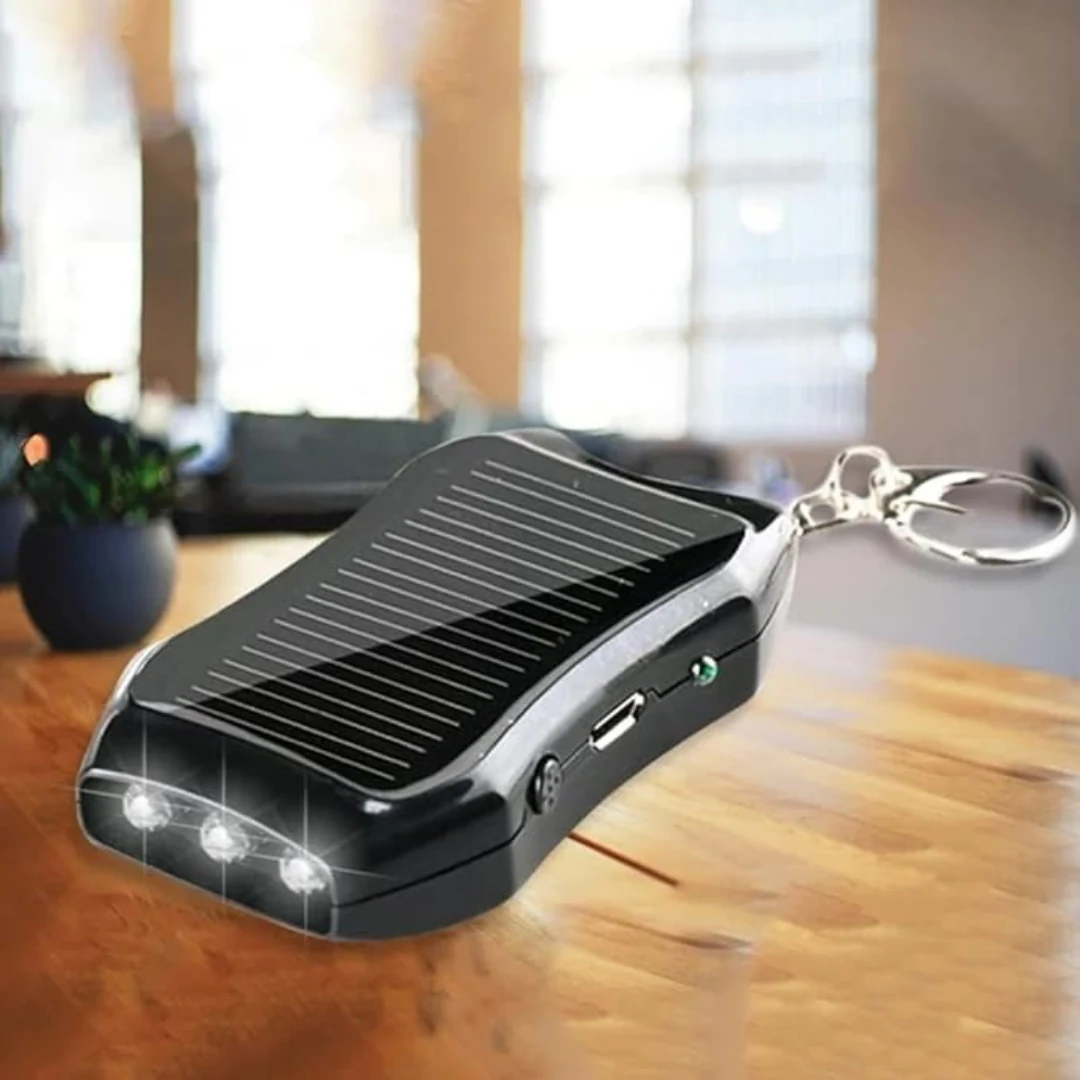 The power bank on a table with its three LEDs lit, the charging port and the indicator light on its side